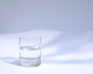 A glass half full of water.