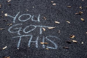 Chalk on the floor saying "You got this"